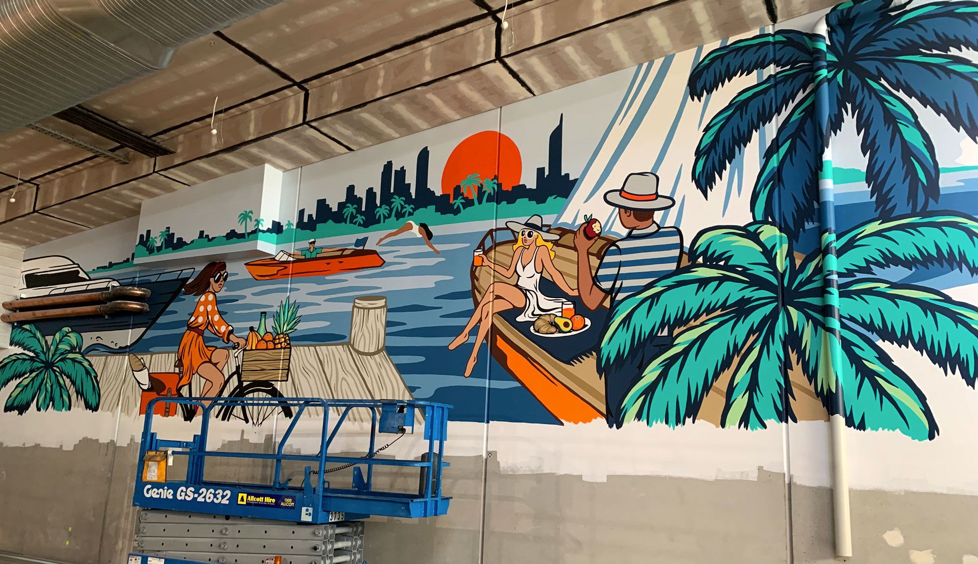 The mural features a Gold Coast waterways view with a skyscape, setting sun and yachts