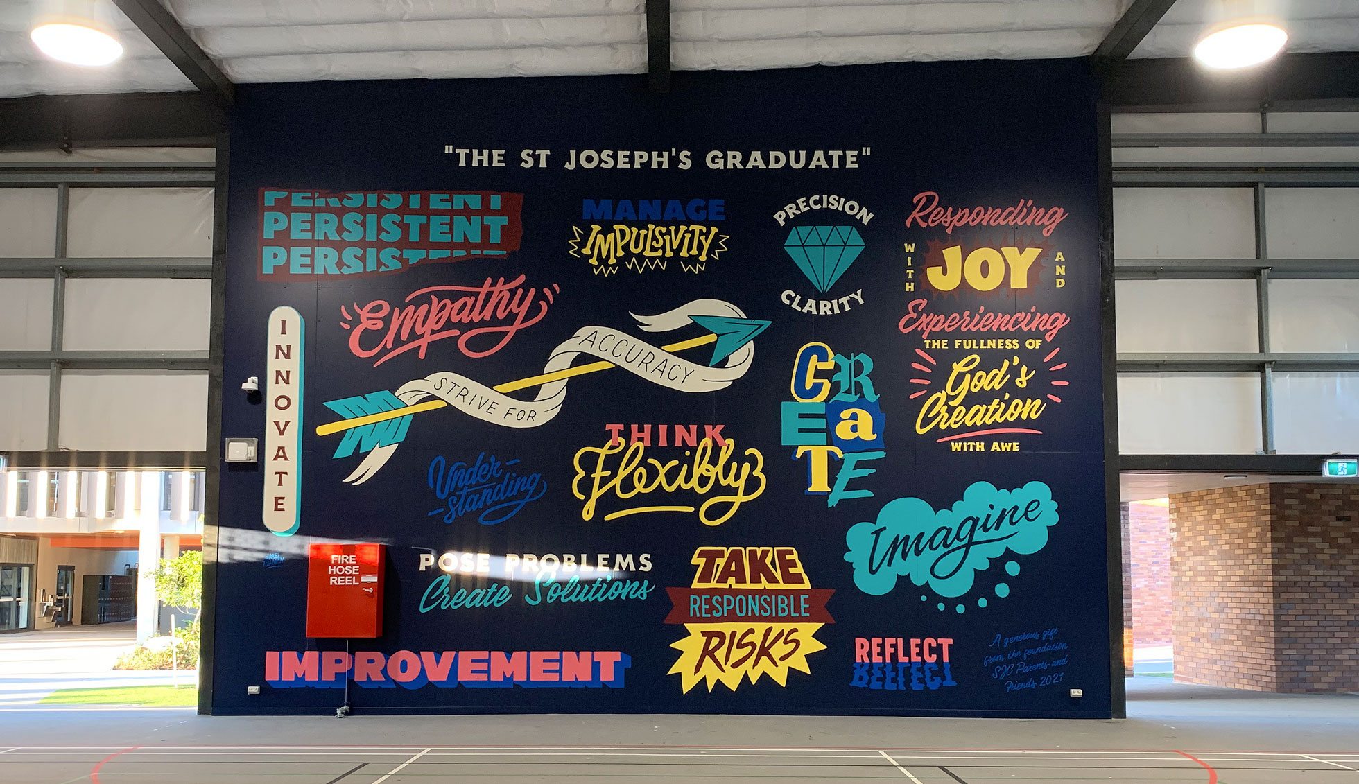 A typography-based mural featuring school values